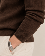 Side view of men’s textured knit polo in espresso brown with a relaxed smart-casual fit