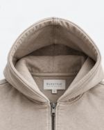 Close-up of women’s acid wash cropped zip hoodie showing washed cotton texture, zipper and fron