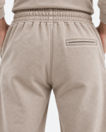 Back view of women’s stone acid wash hoodie and relaxed baggy sweatpants matching set