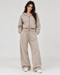 Woman wearing BuxStyle stone acid wash tracksuit set with cropped zip hoodie and relaxed baggy sweatpants