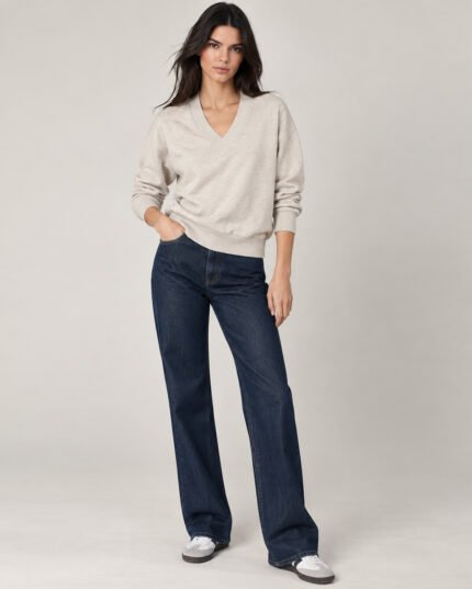 Woman wearing BuxStyle oatmeal beige V-neck lurex sweatshirt with relaxed fit